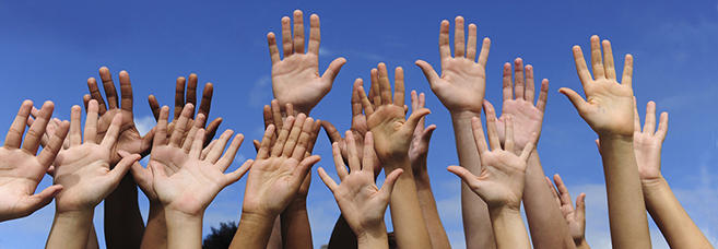 Lots of jubilant raised hands. © Mangostock/Veer